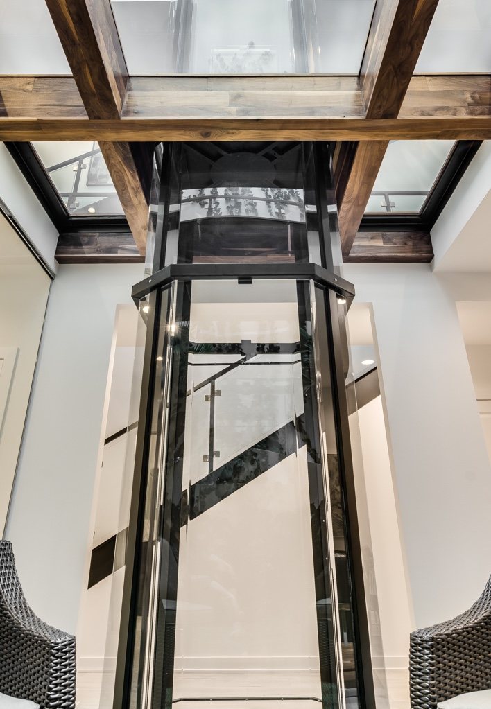 Glass home elevator in a great room